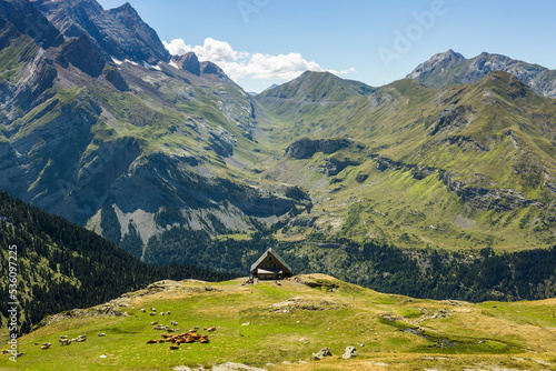 House against mountain ridge in summer photo