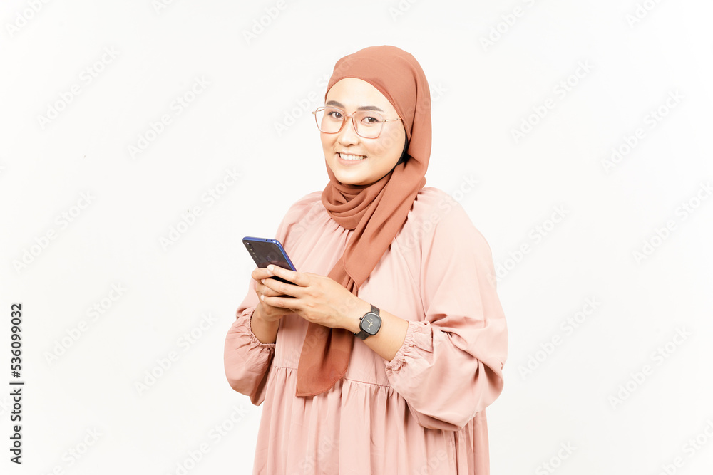Holding Smartphone of Beautiful Asian Woman Wearing Hijab Isolated On White Background Holding Smartphone of Beautiful Asian Woman Wearing Hijab Isolated On White Background