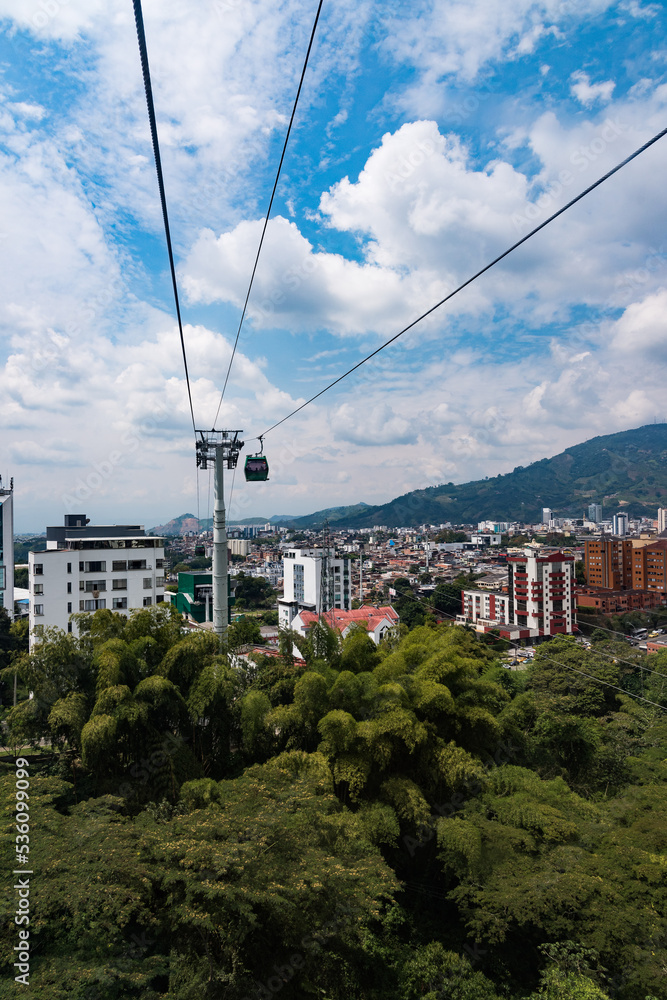 Pereira, Risaralda, Colombia. February 3, 2022: Megacable cars and buildings in the city.