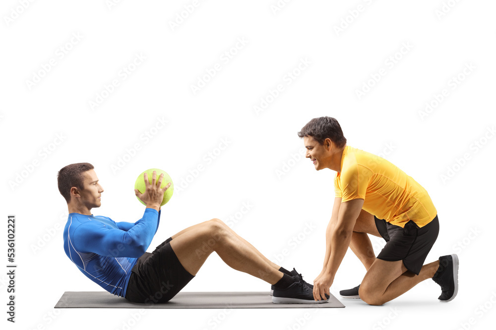 Obraz premium Male athlete exercising with a fitness coach