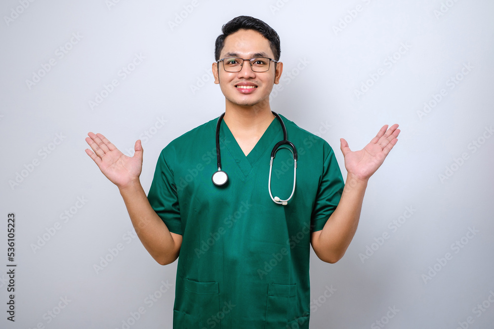 Close-up of surprised and amused happy asian male nurse or doctor, physician hear great news Close-up of surprised and amused happy asian male nurse or doctor, physician hear great news