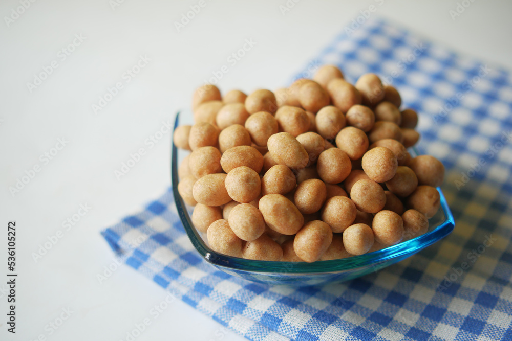indonesia peanuts in a bowl on table top down . indonesia peanuts in a bowl on table top down .