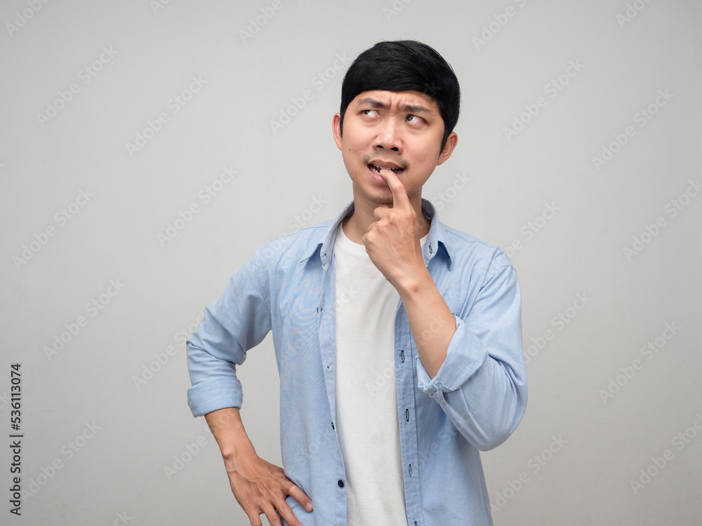 Fototapeta premium Young asian man gesture thoughtful with something isolated