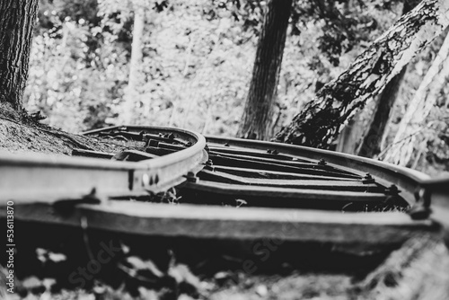 Old narrow gauge train rail in forest at former german military airfield