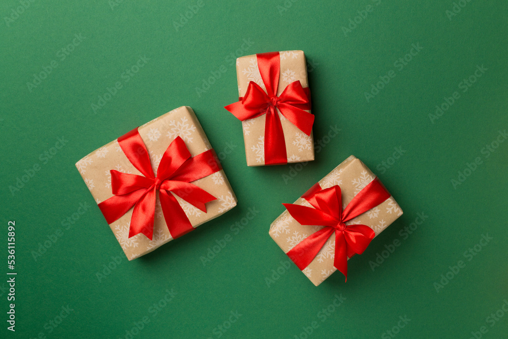 Christmas gift boxes on color background, top view Christmas gift boxes on color background, top view