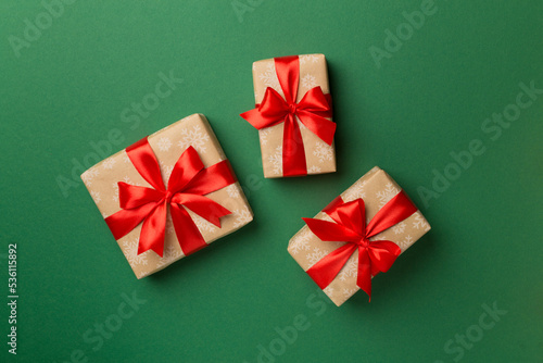 Christmas gift boxes on color background, top view