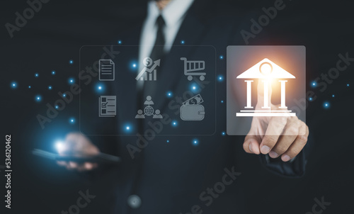 Businessman using mobile online banking and payment, Digital marketing. Finance and banking networking. Online shopping and icon customer network connection, cyber security. Business technology.