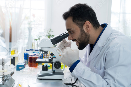 asian botanist working at lab