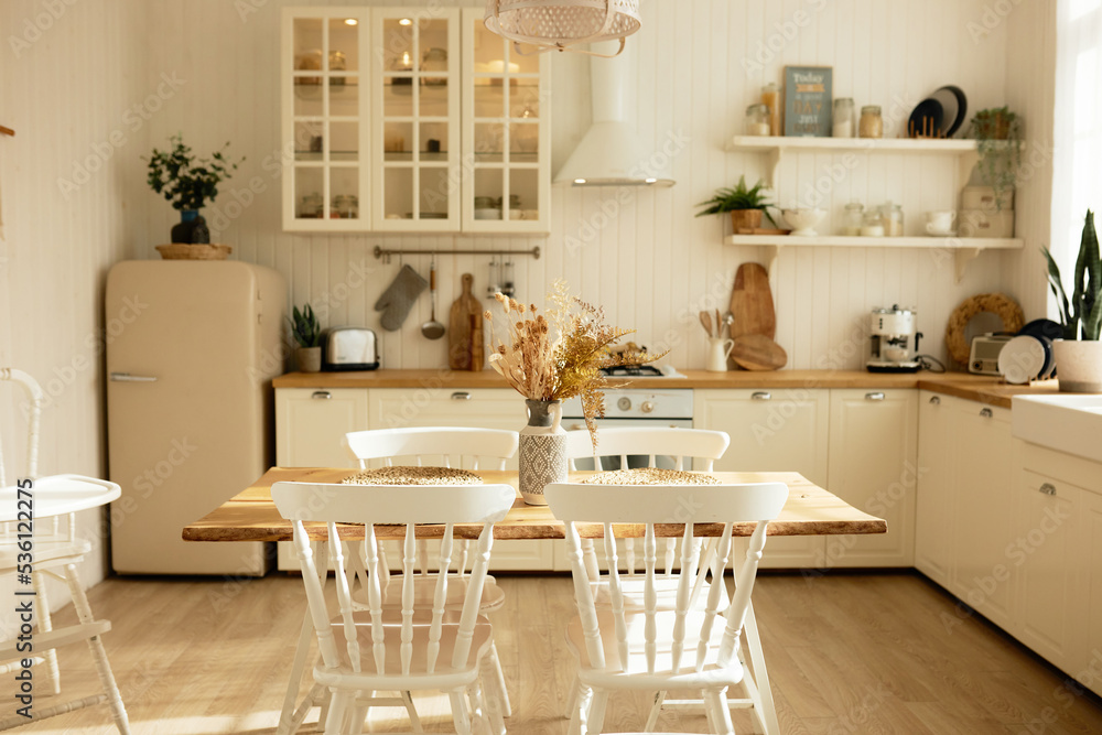 Picture of white cozy kitchen of scandinavian style with counter, oven