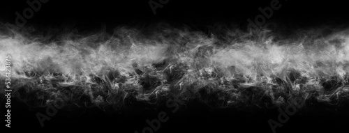 Abstract smoke texture frame over black background. Fog in the darkness. Natural pattern.