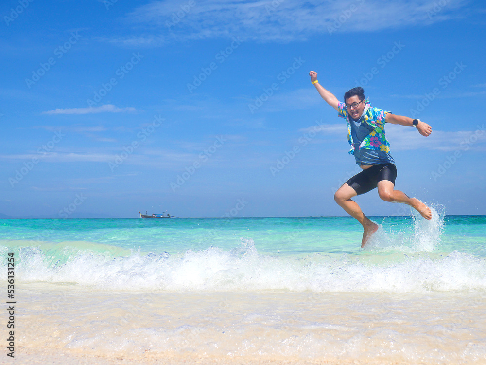 woman jumping on the beach