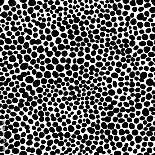 Seamless pattern with round spots. Uneven chaotic black circles, dots on white background. Texture skin of wild animal, simple geometric ornament, abstract fill. Vector print for wallpaper, textile.