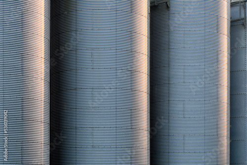 Close up of some corrugated metal storage silo tanks