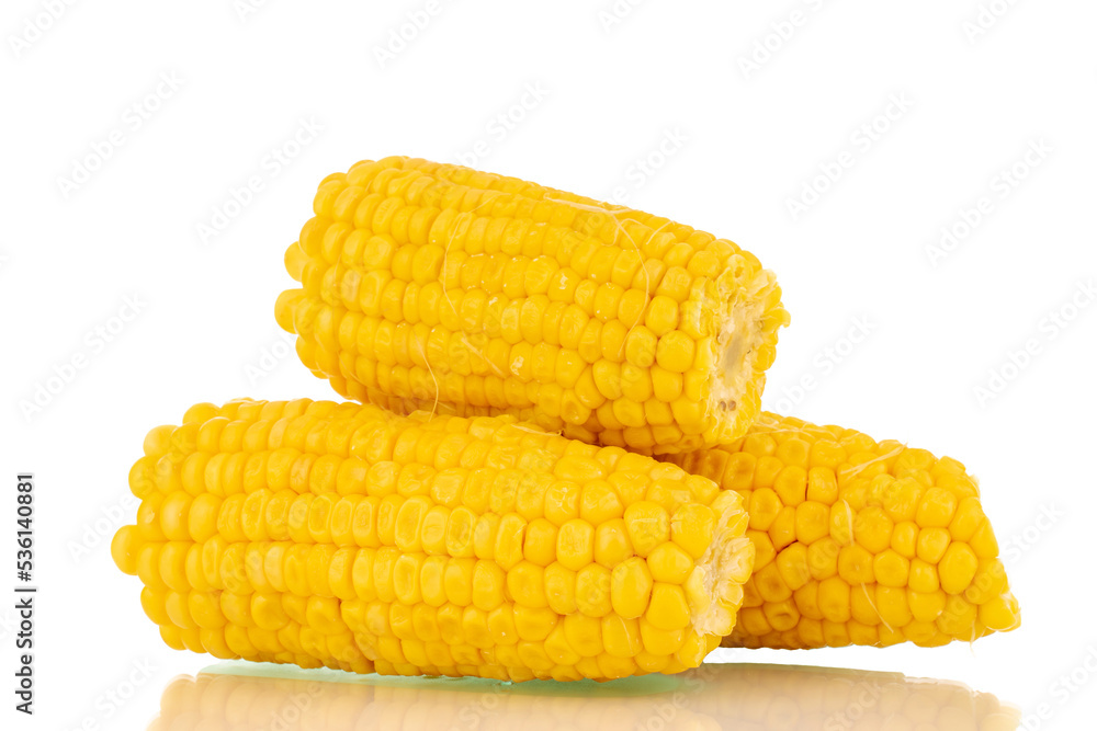 Three fragrant boiled corn, macro, isolated on white background. Three fragrant boiled corn, macro, isolated on white background.