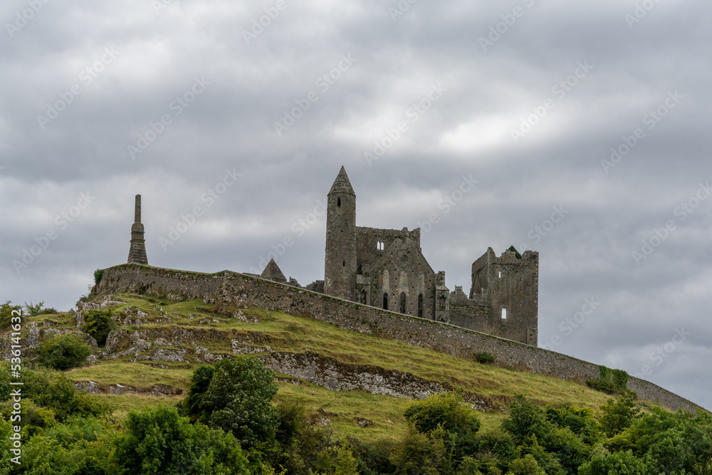 view of the historic Rock of Cashel in County Tipperary of Ireland under an overcast and stormy sky