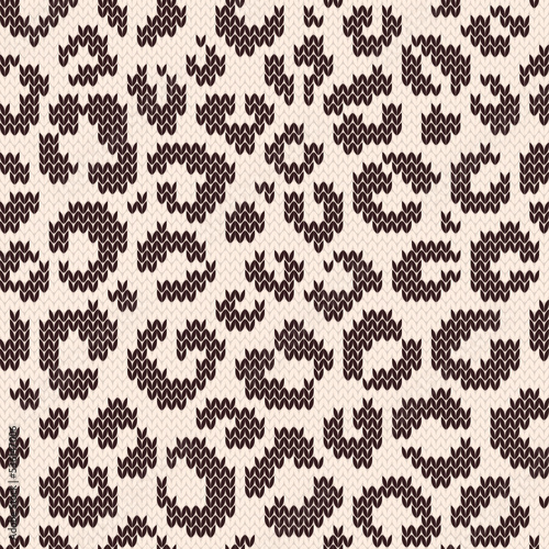 Leopard jacquard knitted seamless pattern. Animal spots on the skin. Textured background for knitwear design or print. Vector illustration.