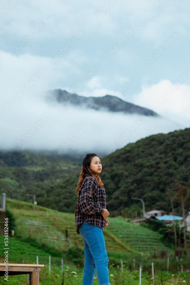 Asian woman taking pictures, vacationing, relaxing, enjoying the air, enjoying the day off by traveling to nature. enjoy a vacation in nature.