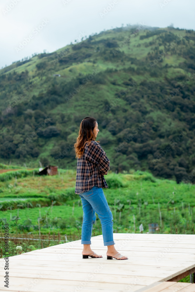 Asian woman taking pictures, vacationing, relaxing, enjoying the air, enjoying the day off by traveling to nature. enjoy a vacation in nature. Asian woman taking pictures, vacationing, relaxing, enjoying the air, enjoying the day off by traveling to nature. enjoy a vacation in nature.