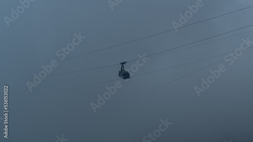 Cable car coming out of the clouds in Austrian Alps glacier