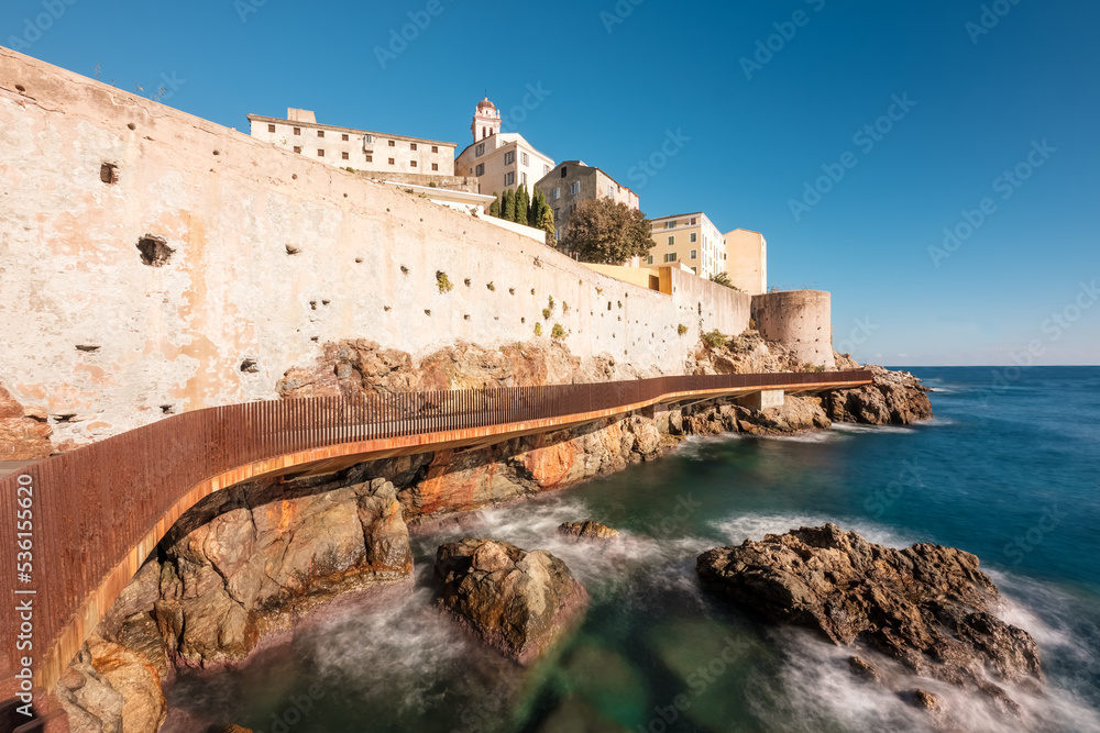 The L'Aldilonda walkway along the rocky east coast and city wall below the citadel of Bastia on the east coast of Corsica