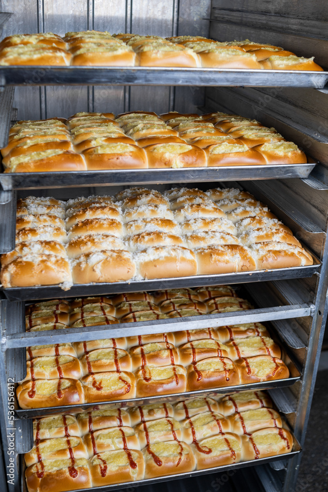 traditional sweet bread from Brazil, industrial manufacture in the bakery of sweet bread with guava and grated coconut, Brazilian bread.