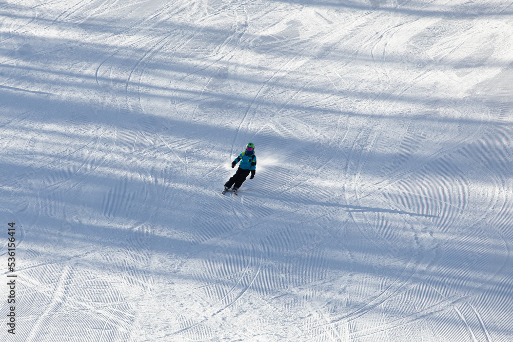A child while skiing in a ski resort.