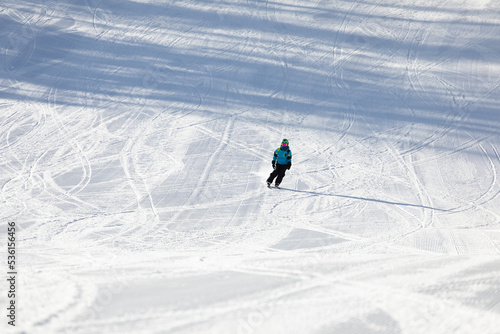 Obraz na płótnie A child while skiing in a ski resort. w salonie
