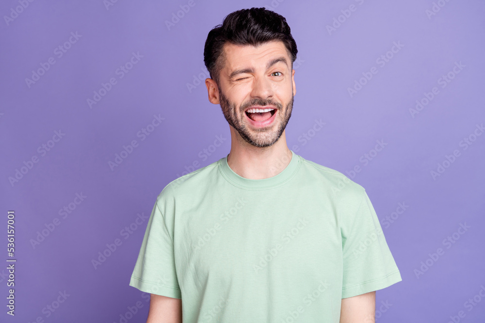 Photo of nice cool guy dressed fashionable quality outfit winking eye flirting girlfriend isolated on purple color background Photo of nice cool guy dressed fashionable quality outfit winking eye flirting girlfriend isolated on purple color background