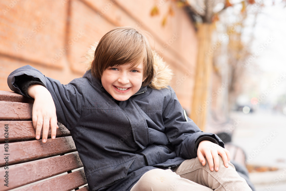 portrait of a smiling schoolboy outside portrait of a smiling schoolboy outside