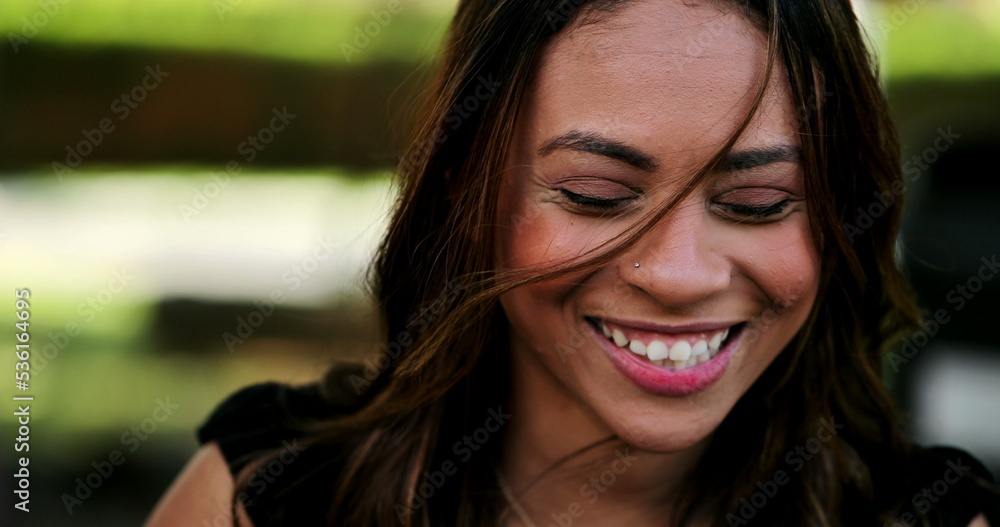 Obraz premium Hispanic woman laughing and smiling spontaneous laughter