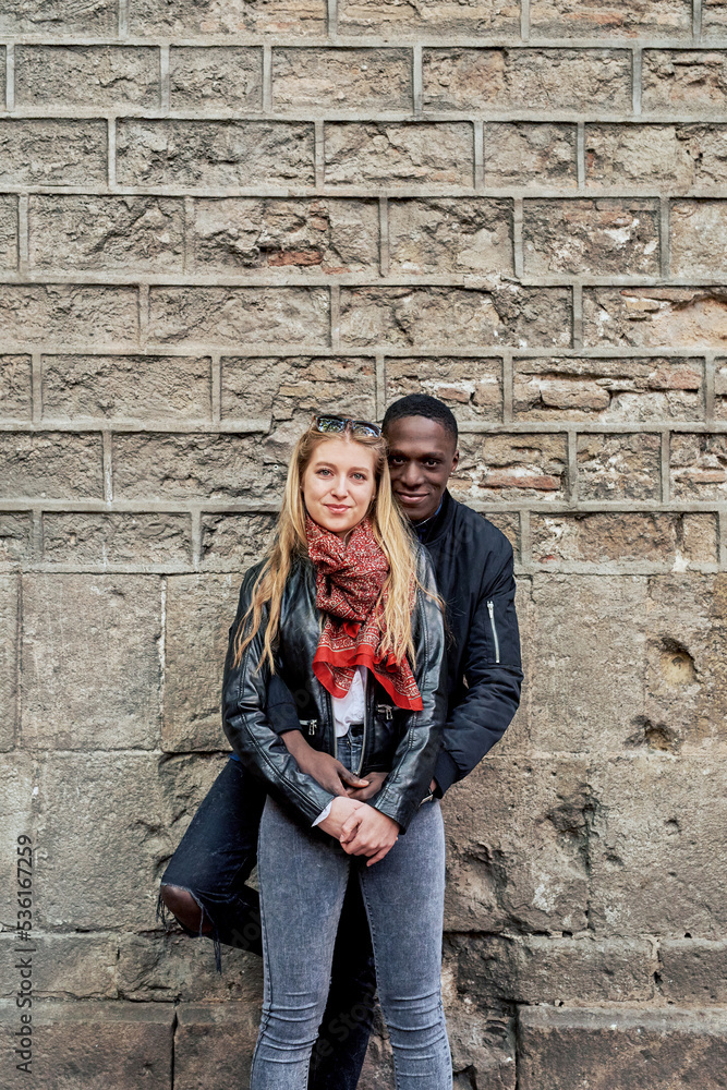 Smiling couple embracing in the street. Smiling couple embracing in the street.