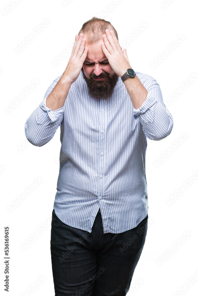 Young caucasian hipster man over isolated background suffering from headache desperate and stressed because pain and migraine. Hands on head. Young caucasian hipster man over isolated background suffering from headache desperate and stressed because pain and migraine. Hands on head.