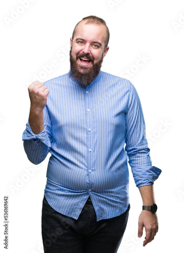 Young caucasian hipster man over isolated background celebrating surprised and amazed for success with arms raised and open eyes. Winner concept.