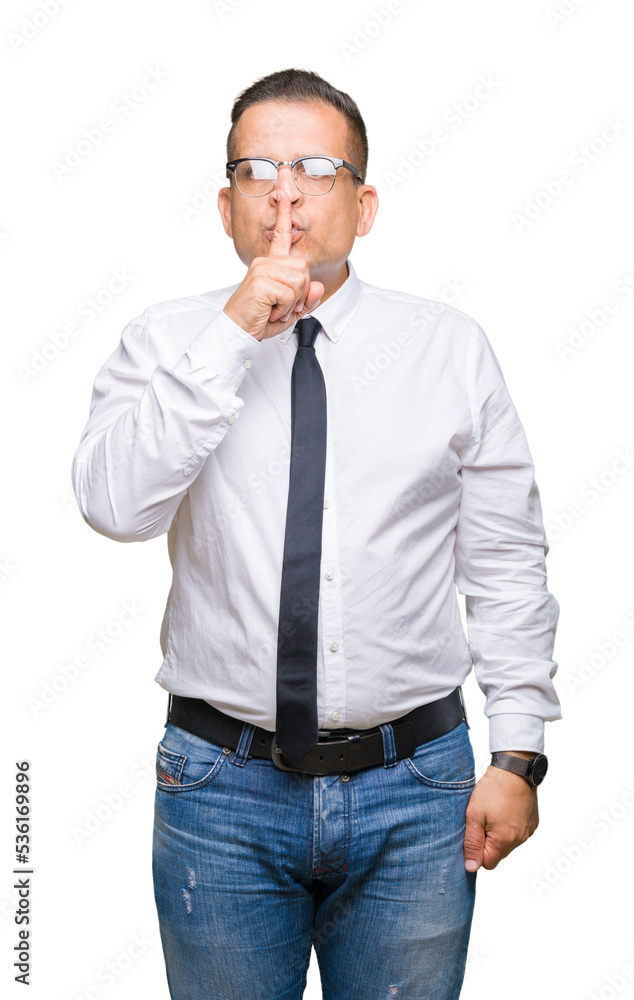 Middle age bussines arab man wearing glasses over isolated background asking to be quiet with finger on lips. Silence and secret concept. Middle age bussines arab man wearing glasses over isolated background asking to be quiet with finger on lips. Silence and secret concept.