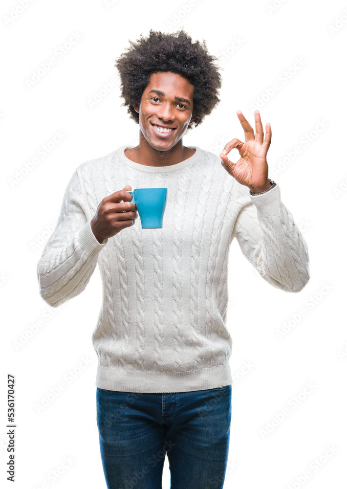 Afro american man drinking cup of coffee over isolated background doing ok sign with fingers, excellent symbol Afro american man drinking cup of coffee over isolated background doing ok sign with fingers, excellent symbol