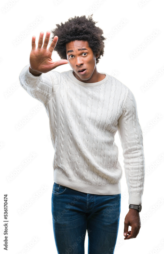 Afro american man over isolated background doing stop sing with palm of the hand. Warning expression with negative and serious gesture on the face. Afro american man over isolated background doing stop sing with palm of the hand. Warning expression with negative and serious gesture on the face.