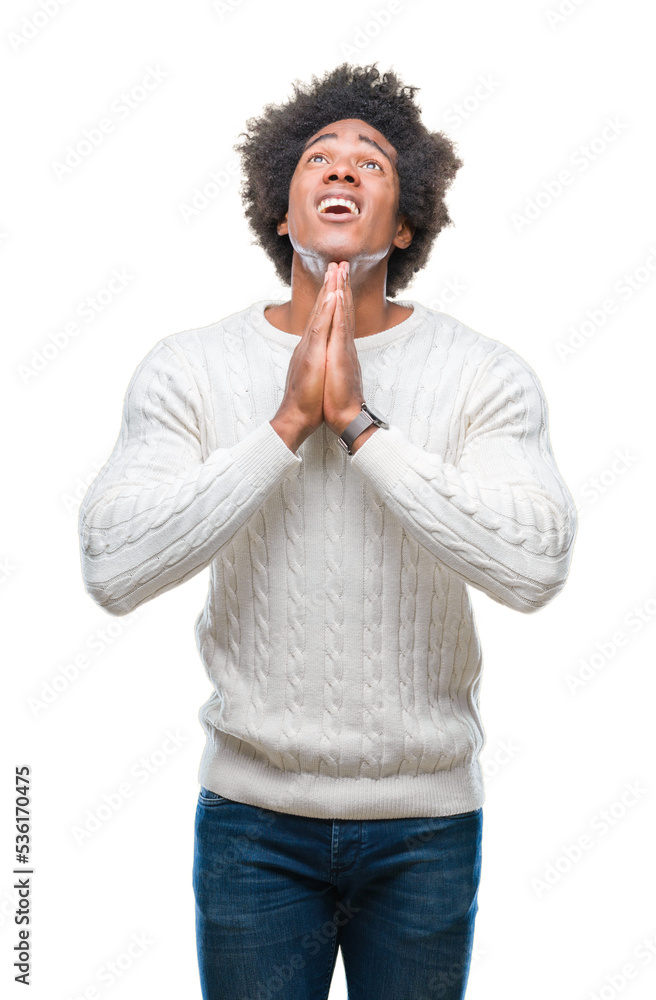 Afro american man over isolated background begging and praying with hands together with hope expression on face very emotional and worried. Asking for forgiveness. Religion concept. Afro american man over isolated background begging and praying with hands together with hope expression on face very emotional and worried. Asking for forgiveness. Religion concept.