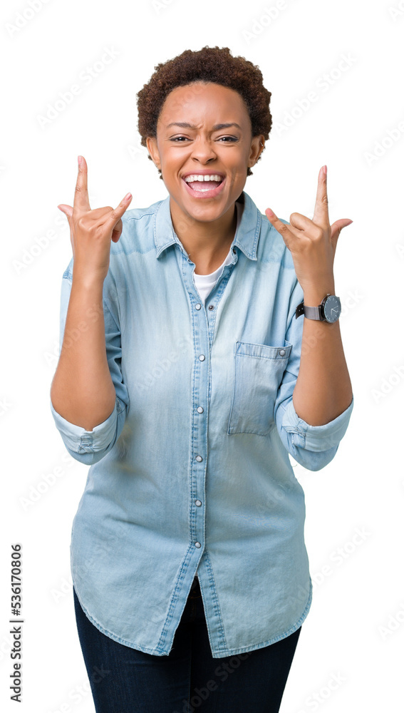 Young beautiful african american woman over isolated background shouting with crazy expression doing rock symbol with hands up. Music star. Heavy concept. Young beautiful african american woman over isolated background shouting with crazy expression doing rock symbol with hands up. Music star. Heavy concept.