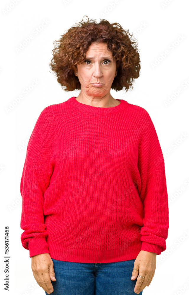 Beautiful middle ager senior woman red winter sweater over isolated background depressed and worry for distress, crying angry and afraid. Sad expression. Beautiful middle ager senior woman red winter sweater over isolated background depressed and worry for distress, crying angry and afraid. Sad expression.