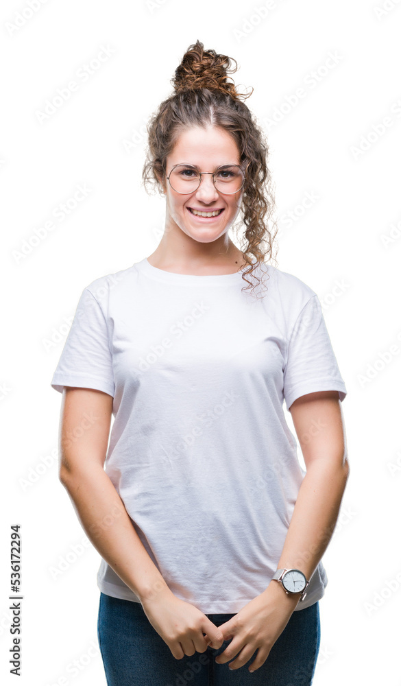 Beautiful young brunette curly hair girl wearing glasses over isolated background with a happy and cool smile on face. Lucky person. Beautiful young brunette curly hair girl wearing glasses over isolated background with a happy and cool smile on face. Lucky person.