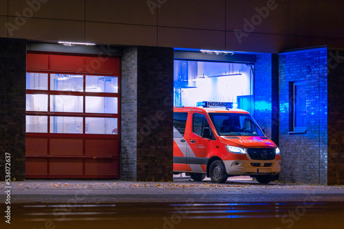 Ambulance at night, blue light, fire department, berlin, germany, out of focus photographed, high ISO, abstract
