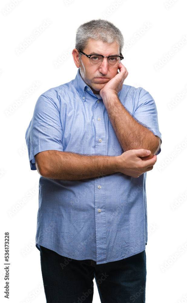 Fototapeta premium Handsome senior man wearing glasses over isolated background thinking looking tired and bored with depression problems with crossed arms.
