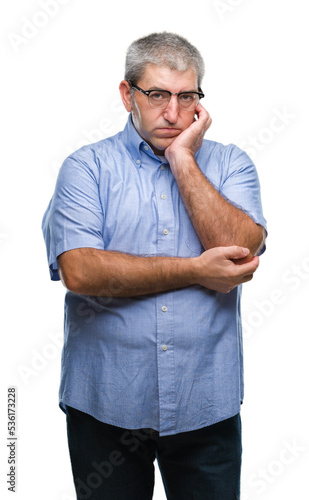Handsome senior man wearing glasses over isolated background thinking looking tired and bored with depression problems with crossed arms.