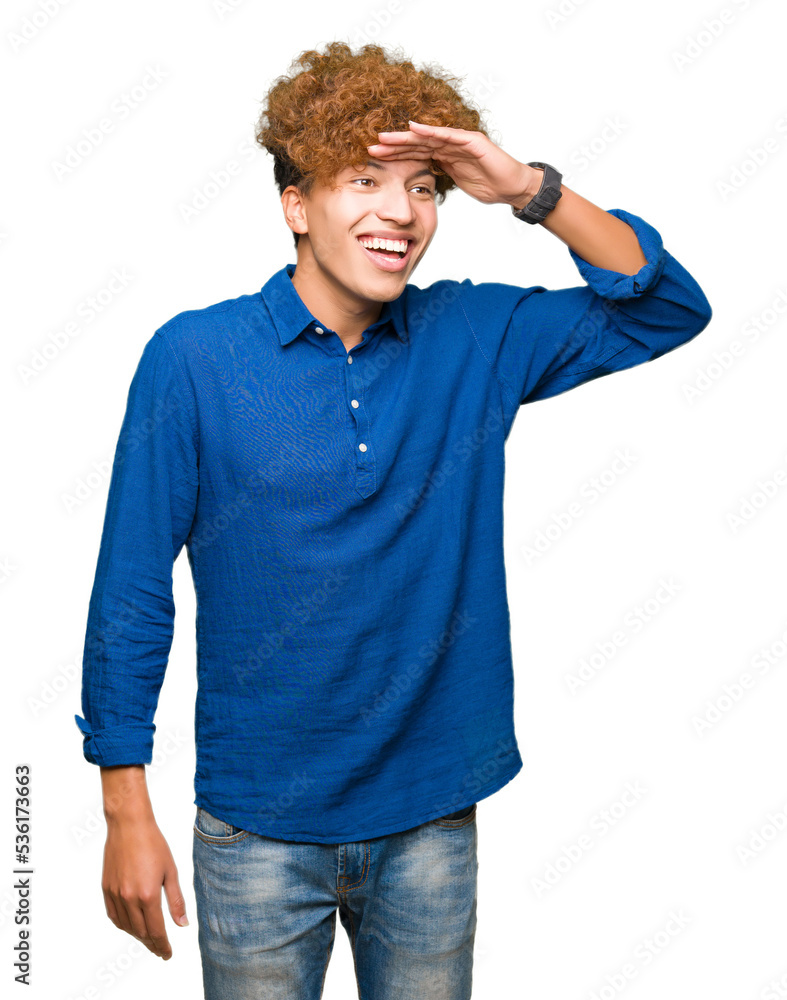 Young handsome elegant man with afro hair very happy and smiling looking far away with hand over head. Searching concept. Young handsome elegant man with afro hair very happy and smiling looking far away with hand over head. Searching concept.