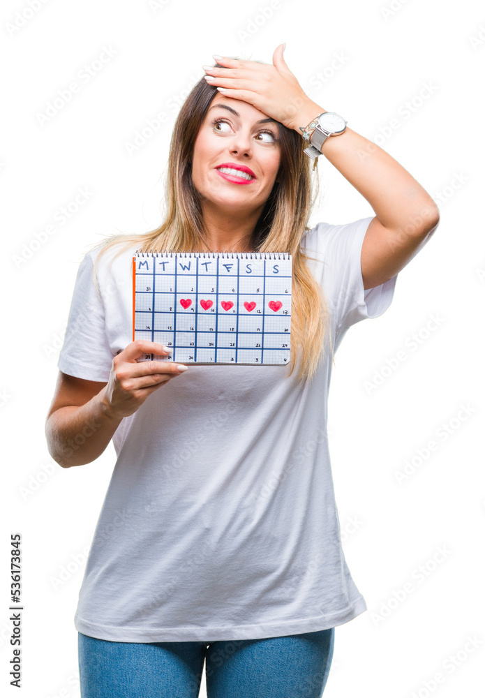 Young beautiful woman holding menstruation calendar over isolated background stressed with hand on head, shocked with shame and surprise face, angry and frustrated. Fear and upset for mistake. Young beautiful woman holding menstruation calendar over isolated background stressed with hand on head, shocked with shame and surprise face, angry and frustrated. Fear and upset for mistake.