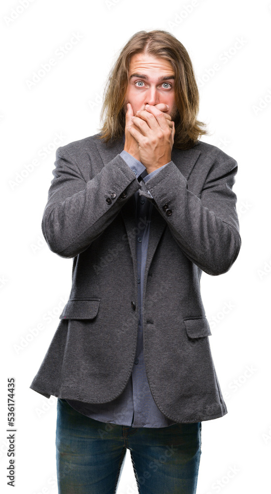 Young handsome business man with long hair over isolated background shocked covering mouth with hands for mistake. Secret concept. Young handsome business man with long hair over isolated background shocked covering mouth with hands for mistake. Secret concept.