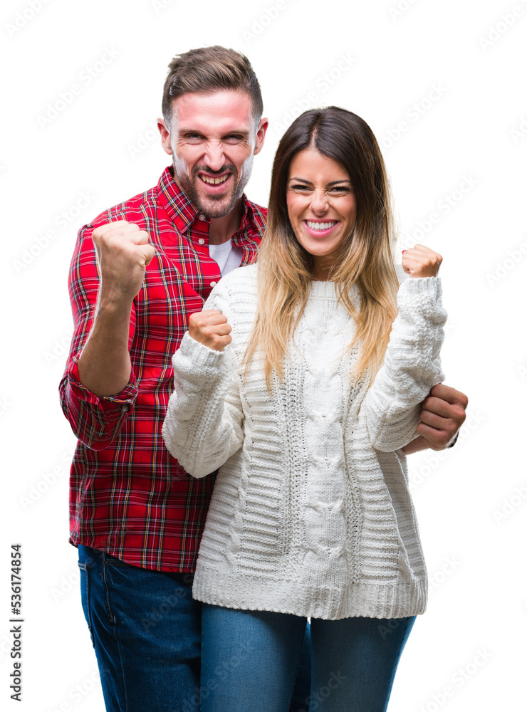 Young couple in love wearing winter sweater over isolated background very happy and excited doing winner gesture with arms raised, smiling and screaming for success. Celebration concept. Young couple in love wearing winter sweater over isolated background very happy and excited doing winner gesture with arms raised, smiling and screaming for success. Celebration concept.