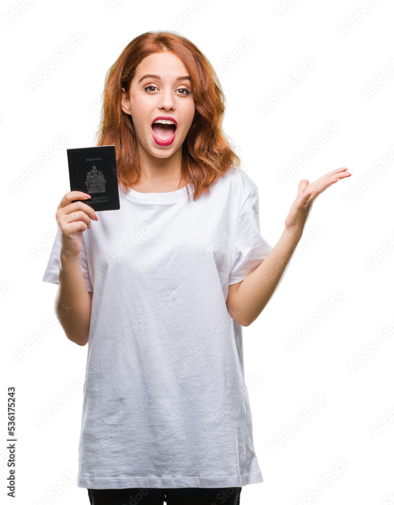 Young beautiful woman holding passport of canada over isolated background very happy and excited, winner expression celebrating victory screaming with big smile and raised hands Young beautiful woman holding passport of canada over isolated background very happy and excited, winner expression celebrating victory screaming with big smile and raised hands