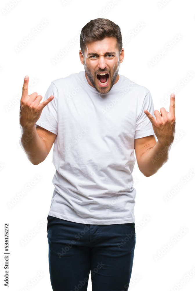 Young handsome man over isolated background shouting with crazy expression doing rock symbol with hands up. Music star. Heavy concept. Young handsome man over isolated background shouting with crazy expression doing rock symbol with hands up. Music star. Heavy concept.