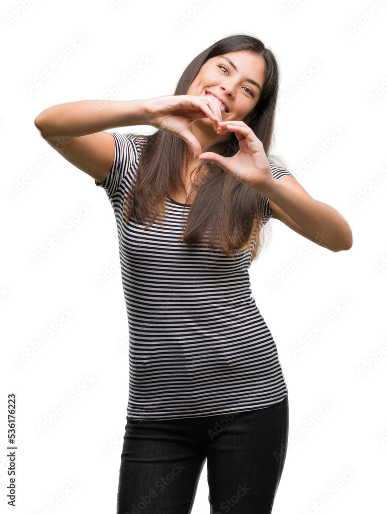 Young beautiful hispanic woman smiling in love showing heart symbol and shape with hands. Romantic concept. Young beautiful hispanic woman smiling in love showing heart symbol and shape with hands. Romantic concept.